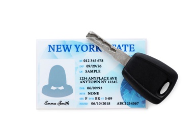 Photo of American driving license and car key on white background, top view