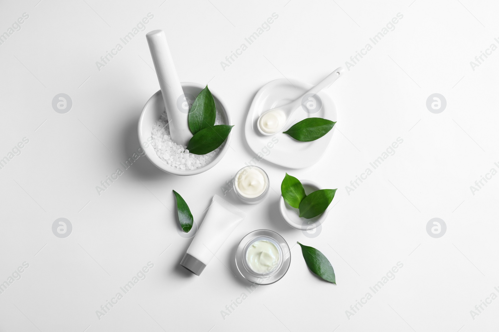 Photo of Flat lay composition with cosmetic products on white background