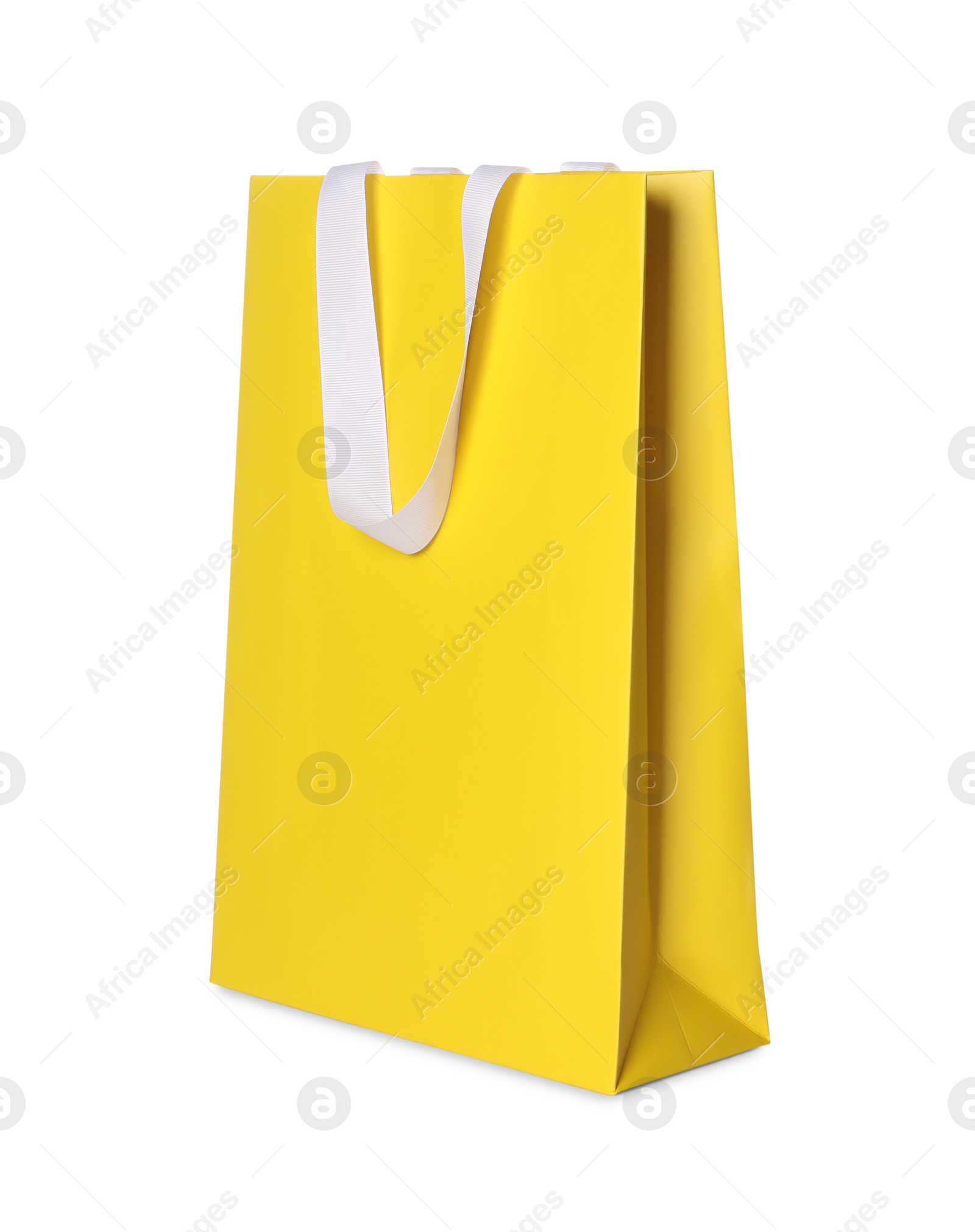 Photo of One yellow shopping bag isolated on white