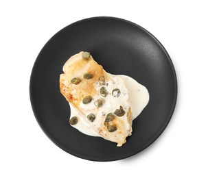 Photo of Delicious chicken fillet with capers and sauce isolated on white, top view