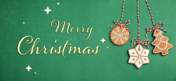 Image of Text MERRY CHRISTMAS and cookies on green background, flat lay. Banner design