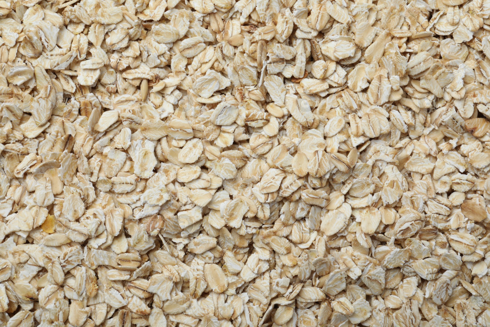 Photo of Pile of oatmeal as background, top view