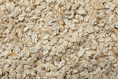 Photo of Pile of oatmeal as background, top view