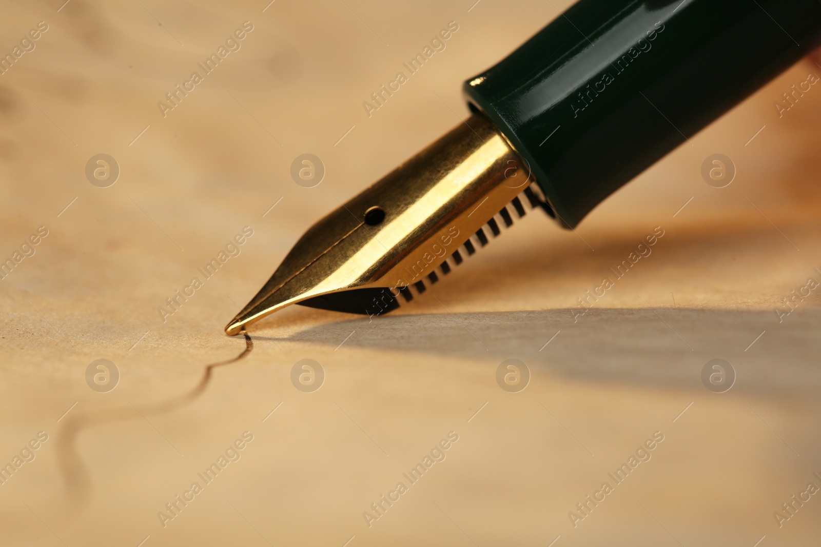 Photo of Drawing line with beautiful fountain pen, closeup