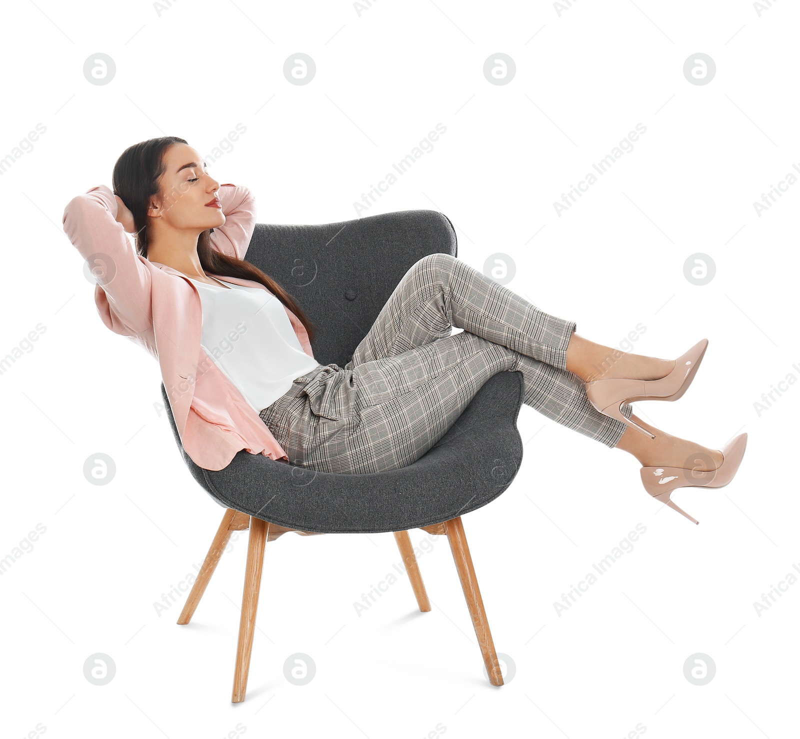 Photo of Young woman resting in armchair on white background