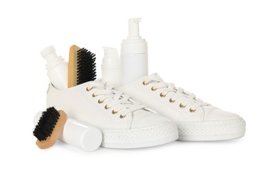 Photo of Composition with stylish footwear and shoe care accessories on white background
