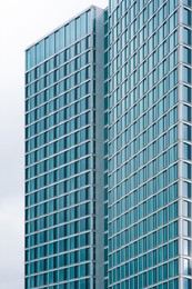 Photo of Modern multistory building with tinted windows outdoors