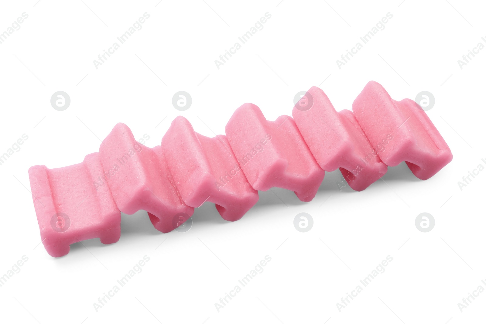 Photo of Many tasty pink chewing gums on white background