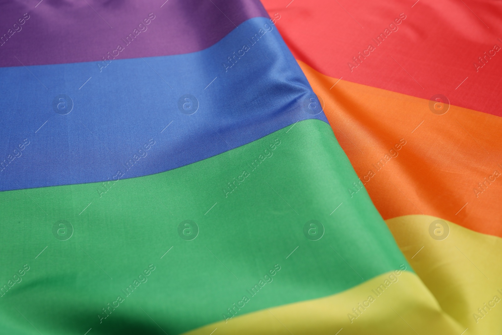 Photo of Rainbow LGBT flag as background, closeup view