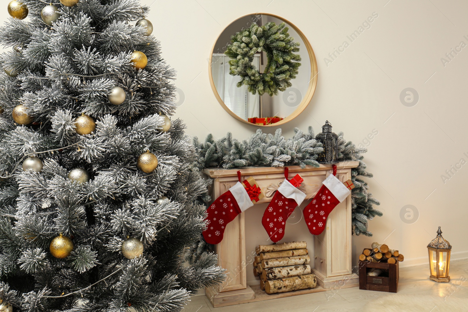 Photo of Stylish Christmas interior with decorated fir tree and fireplace