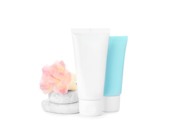 Photo of Cosmetic products, flower and spa stones on white background