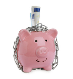 Photo of Piggy bank with steel chain and banknotes isolated on white. Money safety concept