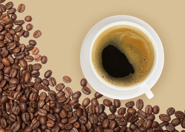 Cup of tasty espresso and roasted coffee beans on beige background, flat lay