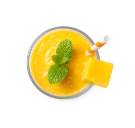 Photo of Glass of tasty mango smoothie isolated on white, top view
