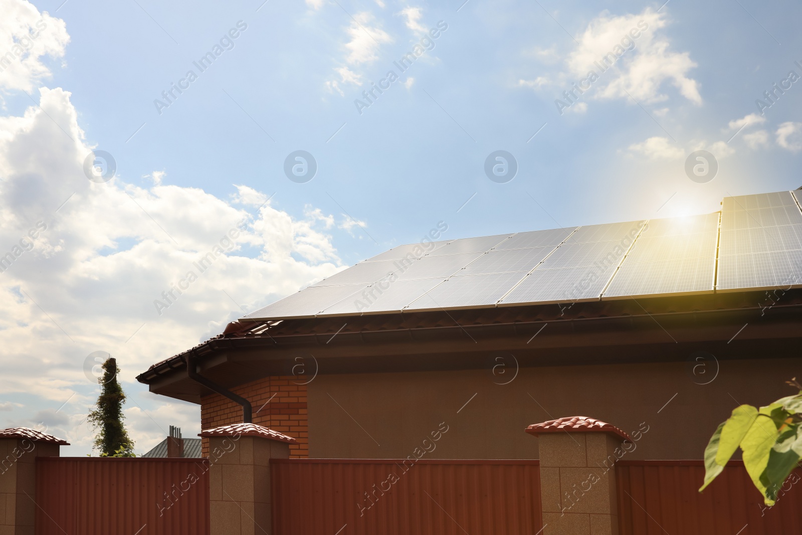 Photo of Building with installed solar panels on roof. Alternative energy source