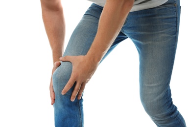 Photo of Man having knee problems on white background, closeup