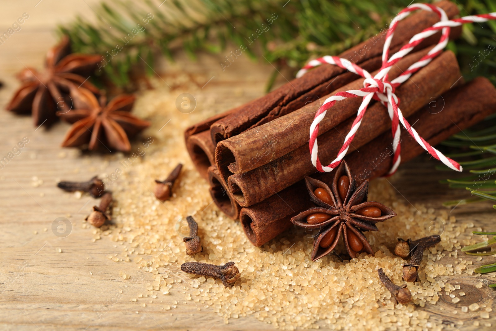 Photo of Different aromatic spices on table, closeup view