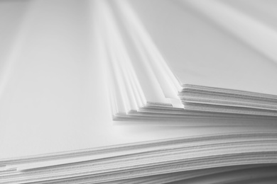 Photo of Stack of blank paper as background, closeup