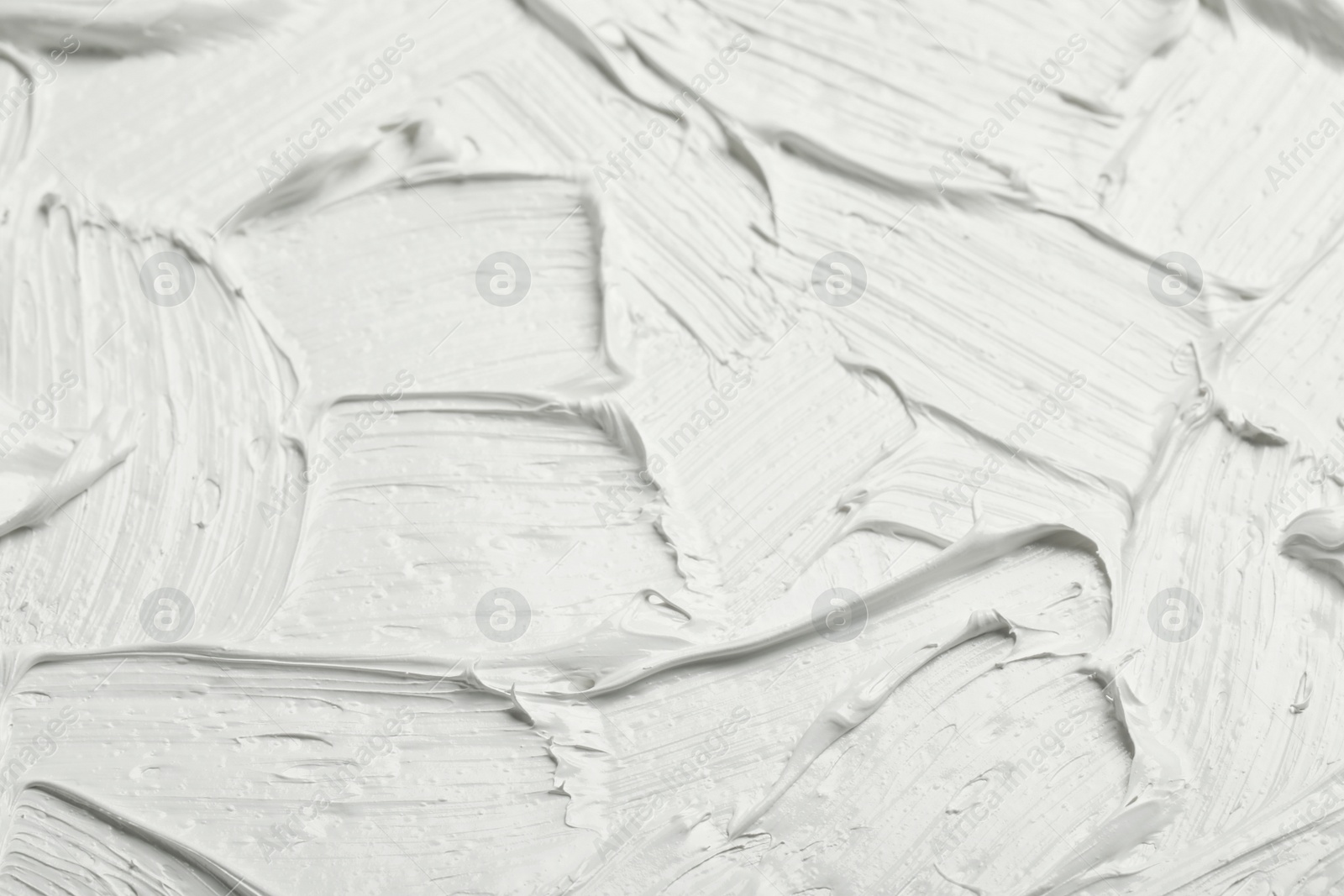 Photo of Texture of white oil paint as background, closeup