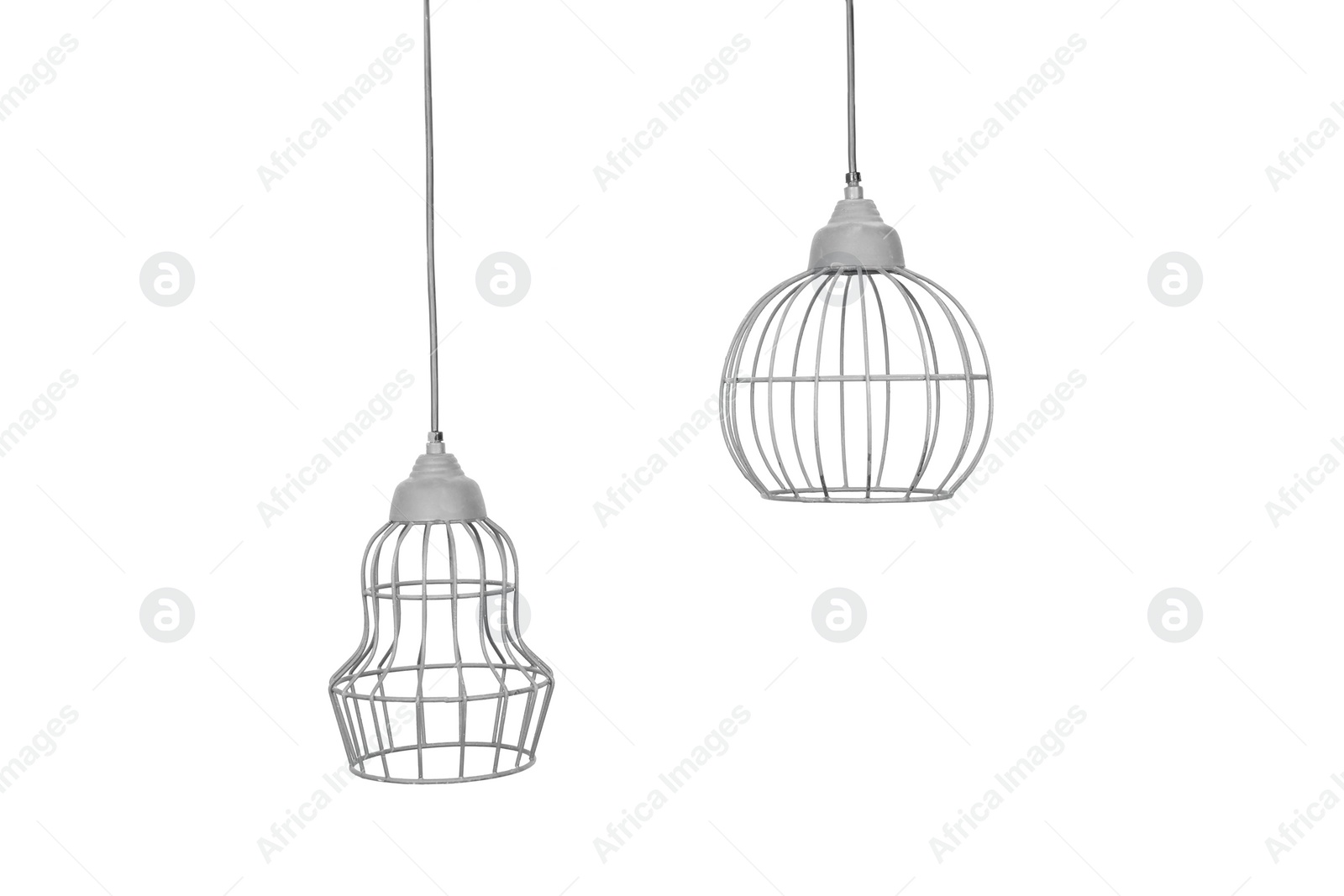 Photo of Stylish pendant lamps hanging on white background