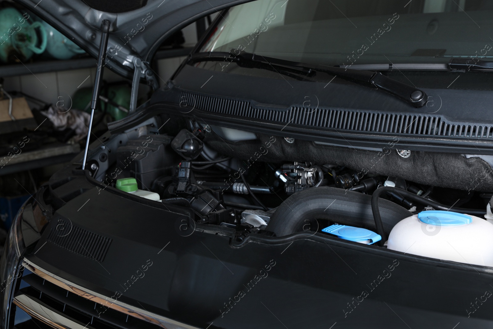 Photo of Closeup view of engine bay in modern auto