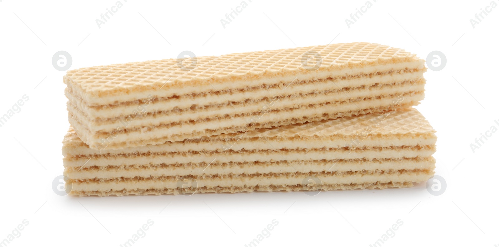 Photo of Delicious vanilla wafer sticks isolated on white