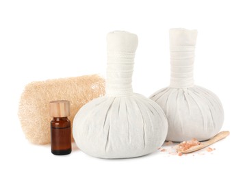 Photo of Herbal massage bags and other spa products on white background