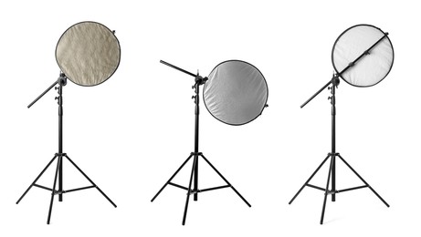 Set of tripods with different reflectors on white background. Professional photographer's equipment