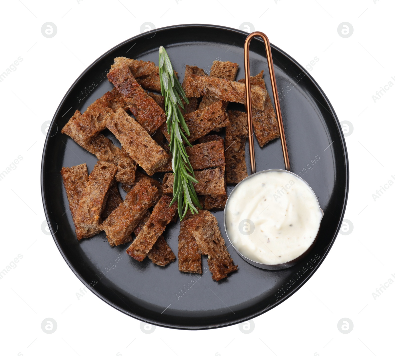 Photo of Crispy rusks with rosemary and sauce isolated on white, top view