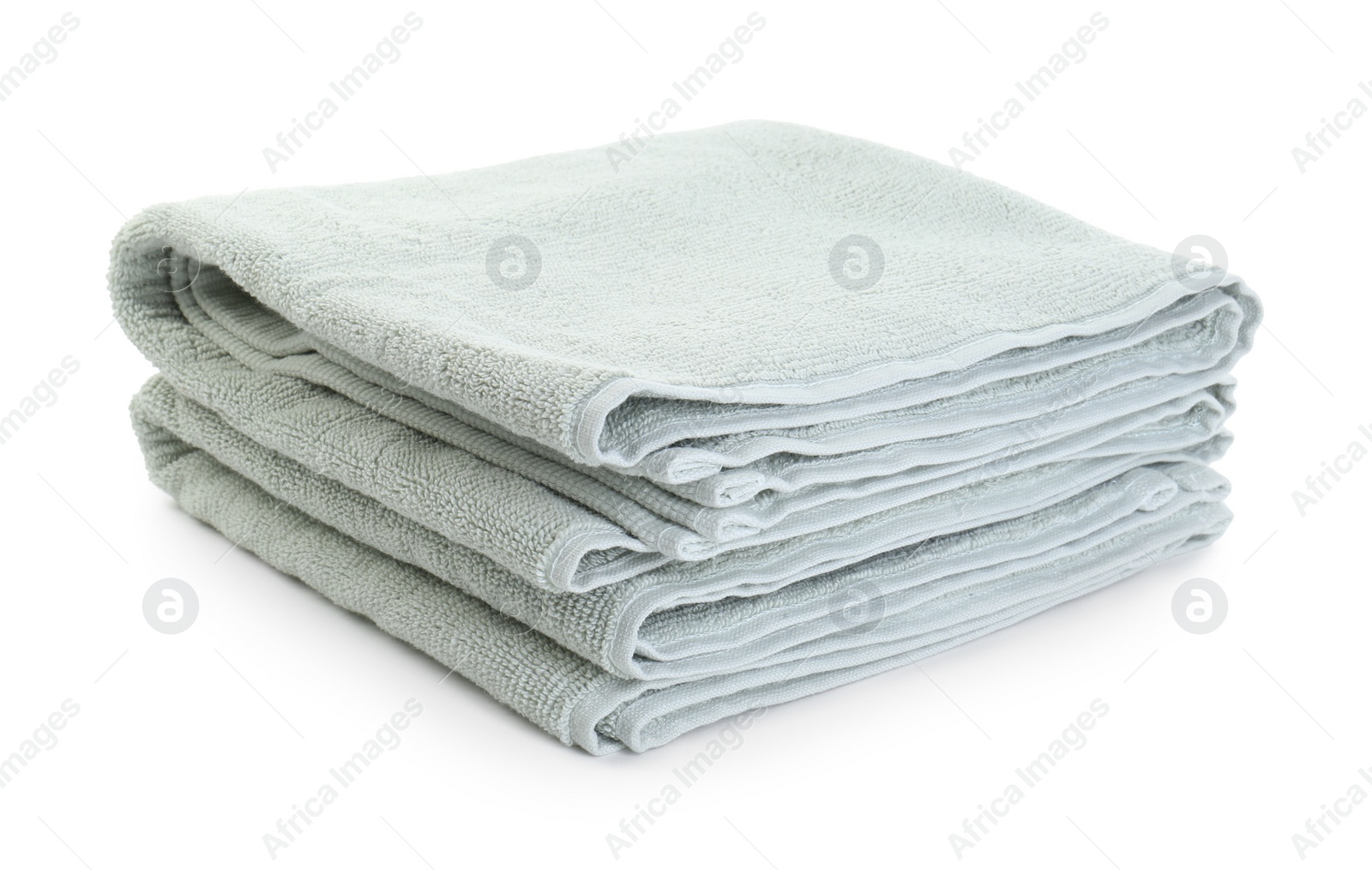 Photo of Soft folded terry towels isolated on white