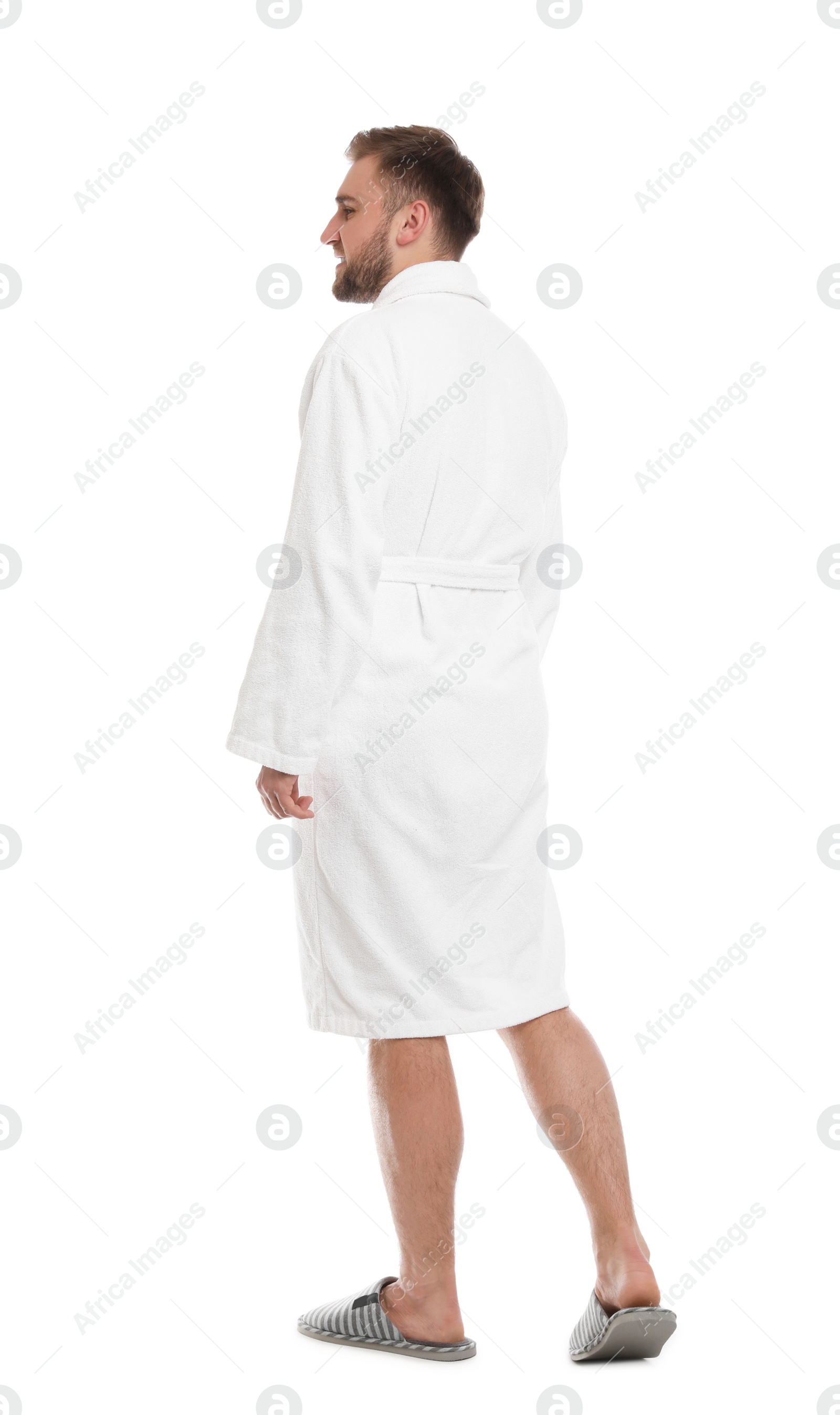 Photo of Handsome man wearing bathrobe on white background