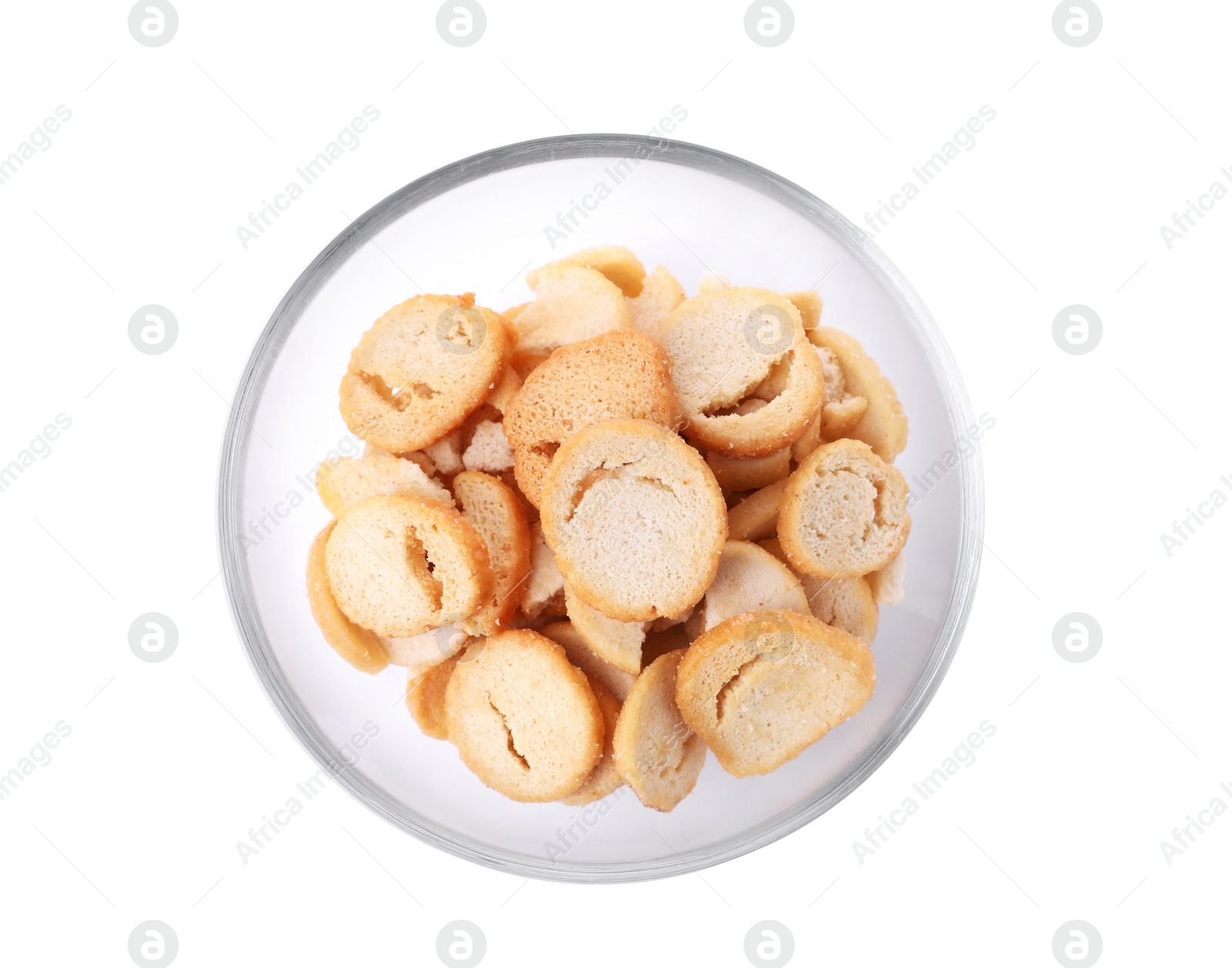 Photo of Delicious crispy rusks in glass bowl on white background, top view