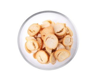 Photo of Delicious crispy rusks in glass bowl on white background, top view