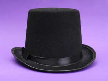 One magician top hat on violet background