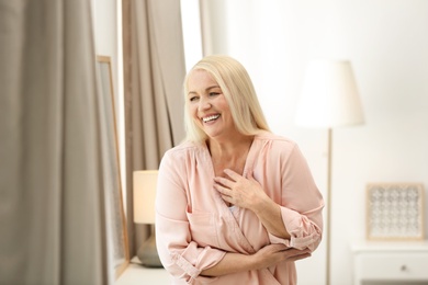 Photo of Portrait of happy mature woman at home