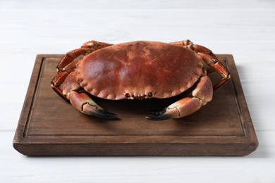 Delicious boiled crab on white wooden table