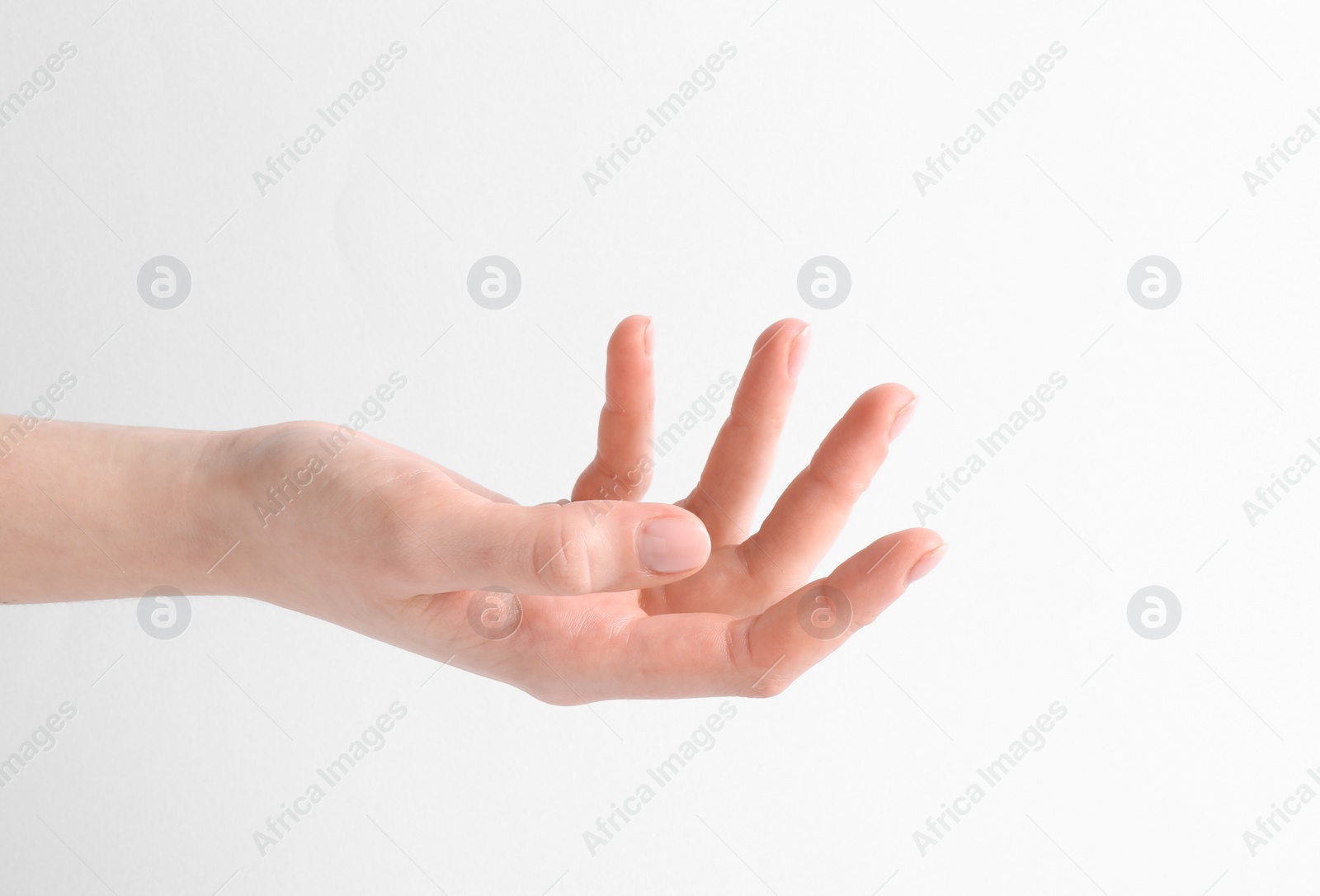 Photo of Woman holding hand on white background, closeup