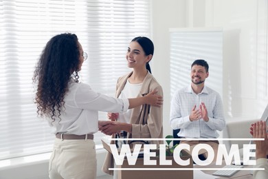 Image of Welcome to team. Employee shaking hands with intern in office