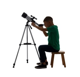 Photo of Little boy looking at stars through telescope on white background