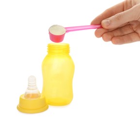 Photo of Woman preparing infant formula on white background, closeup. Baby milk