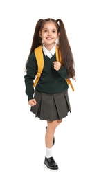 Little girl in stylish school uniform on white background