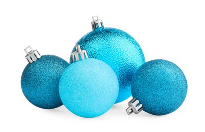 Photo of Beautiful light blue Christmas balls on white background