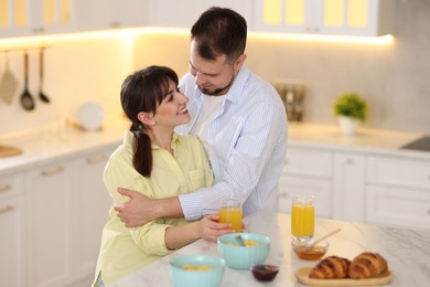 Lovely couple spending time together during breakfast at home