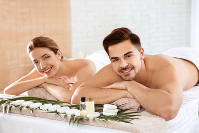 Romantic young couple relaxing in spa salon