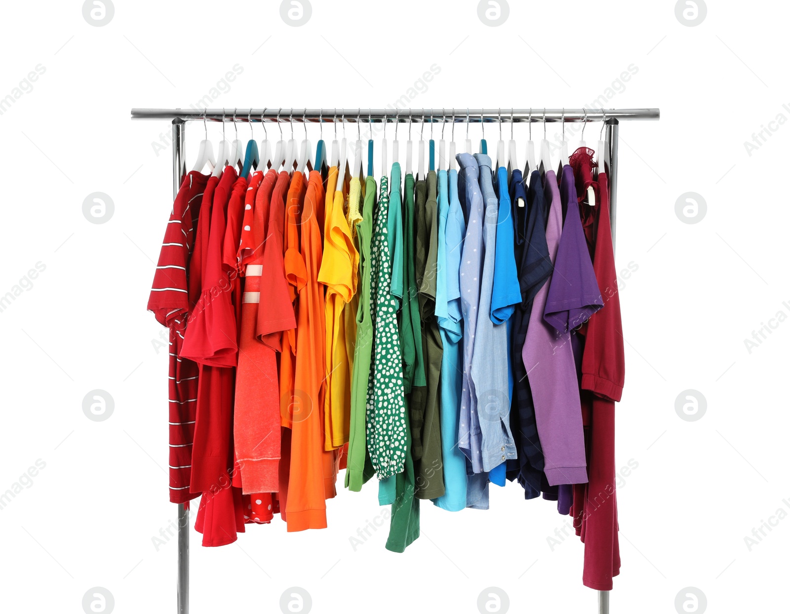 Photo of Wardrobe rack with different colorful clothes on white background