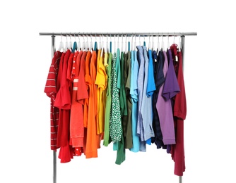 Photo of Wardrobe rack with different colorful clothes on white background