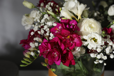 Photo of Beautiful bouquet with spring freesia flowers, closeup