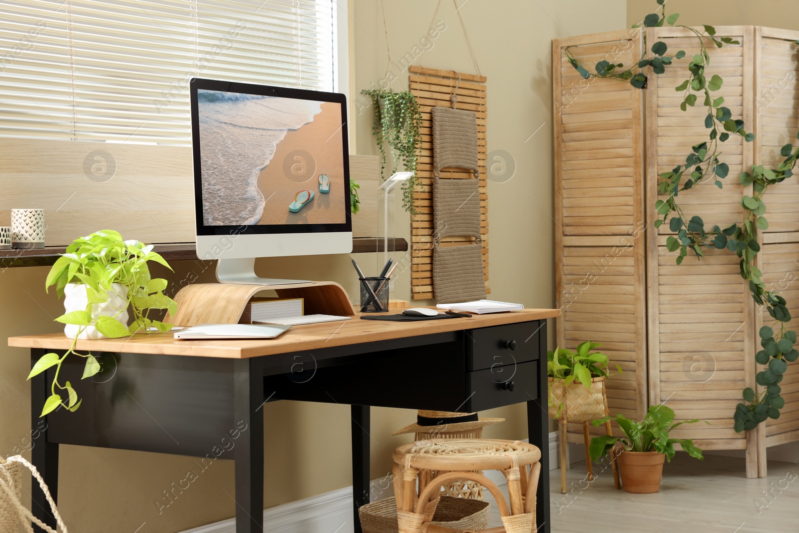 Photo of Light room interior with comfortable workplace near window