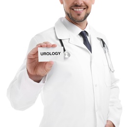 Male doctor holding card with word UROLOGY on white background, closeup