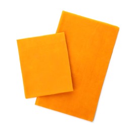 Photo of Orange reusable beeswax food wraps on white background, top view